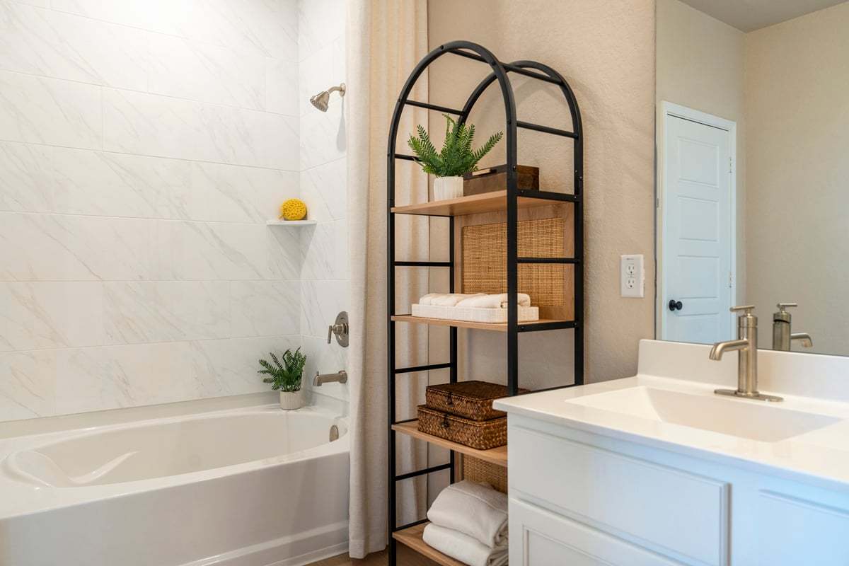Plan 1605 Modeled - Garden tub with tile surround at primary bath