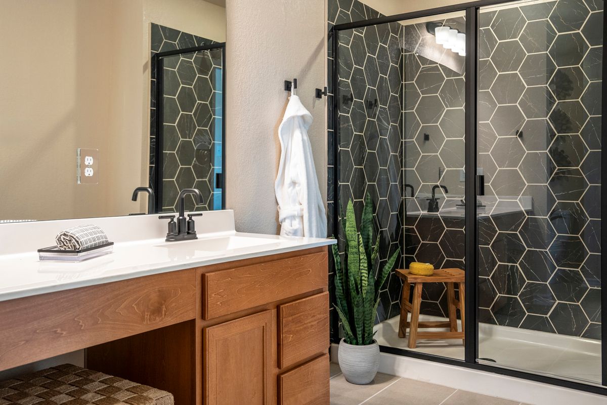 Plan 1676 Modeled - Extended vanity with knee space at primary bath
