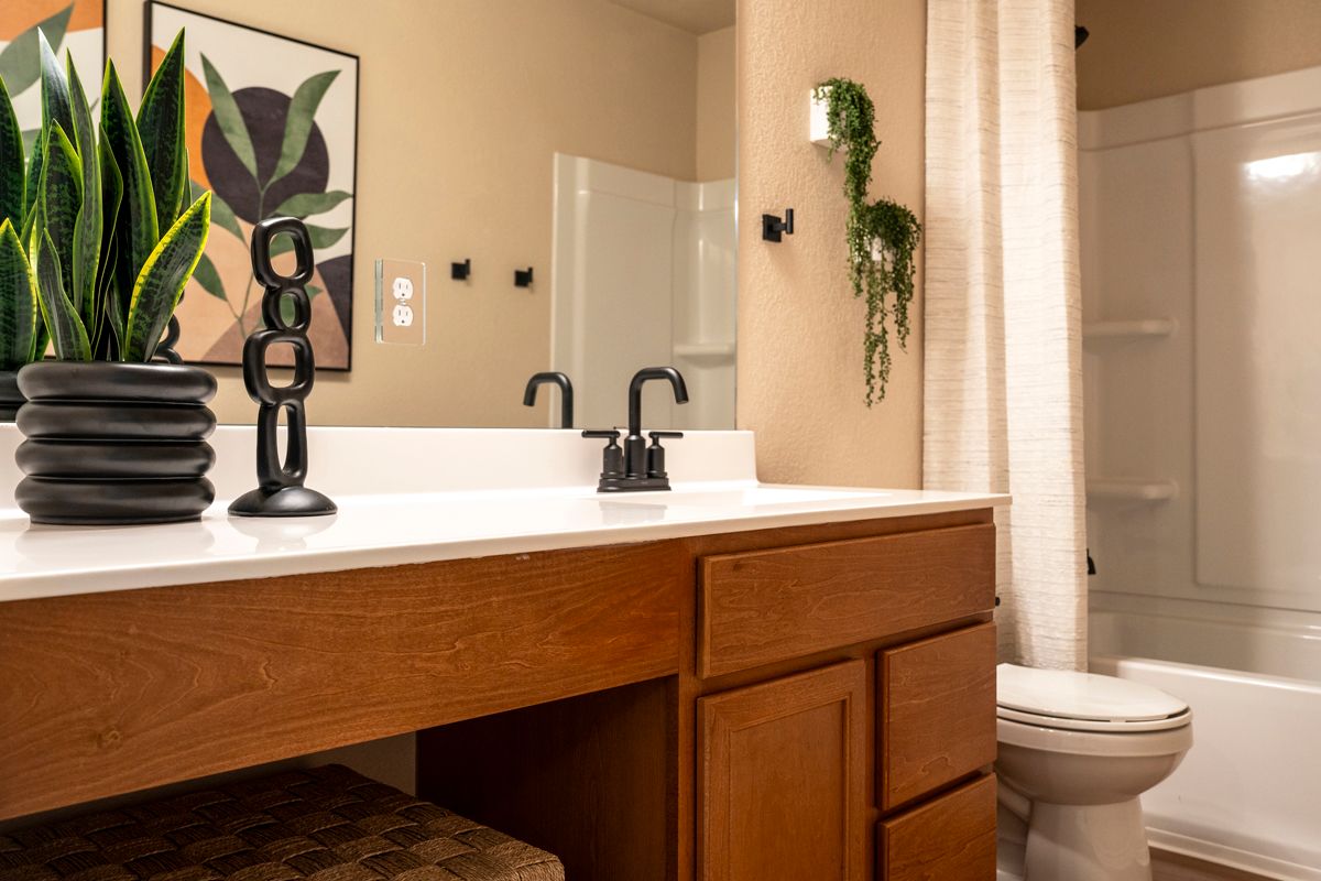Plan 1676 Modeled - Extended vanity with knee space at bath 2