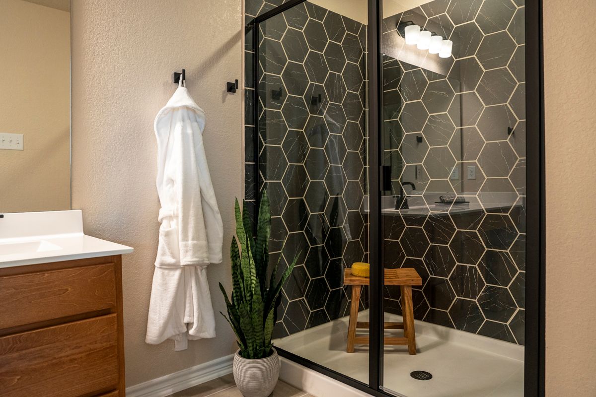 Plan 1676 Modeled - Walk-in shower at primary bath