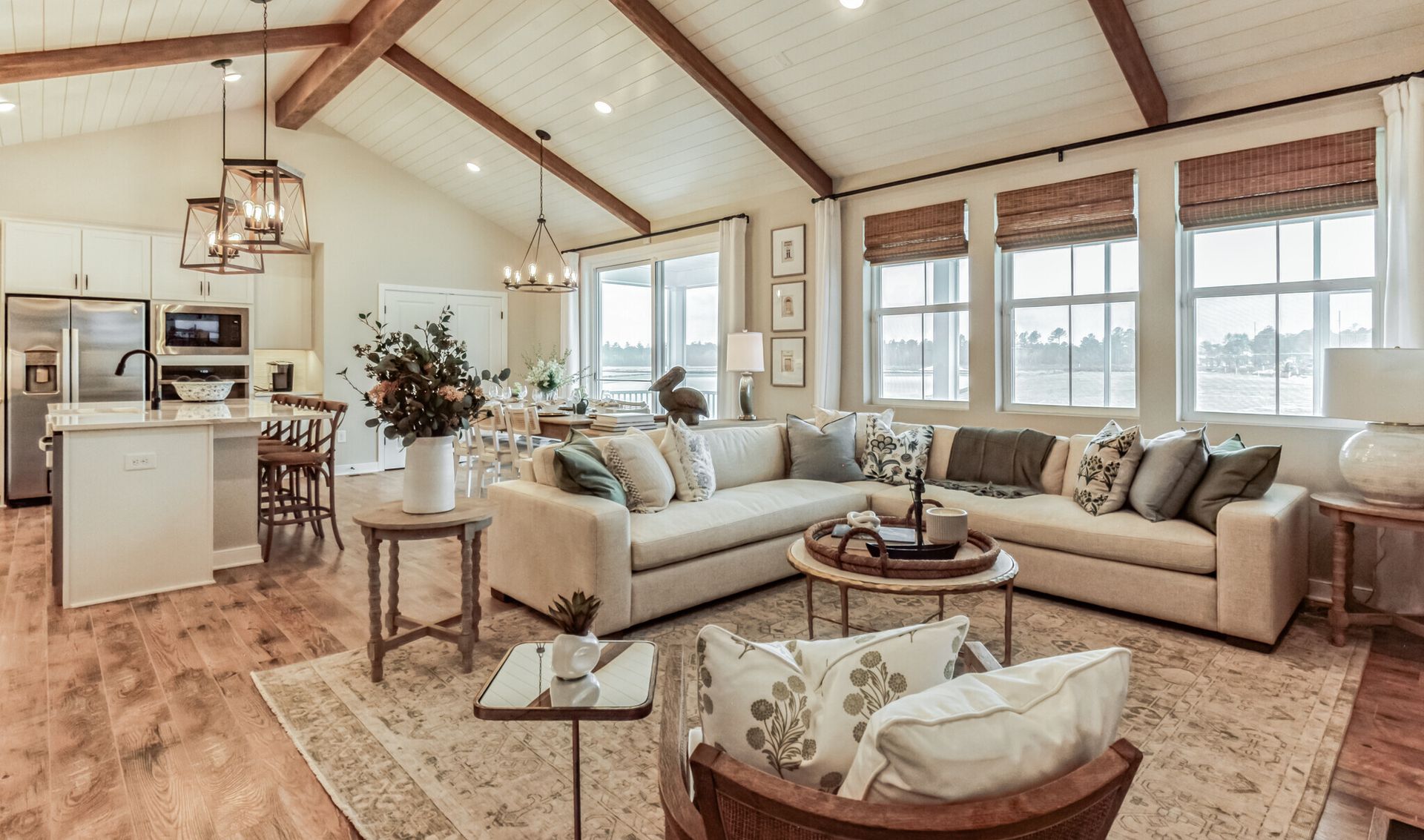 Great room with stained ceiling beams & vaulted ceilings