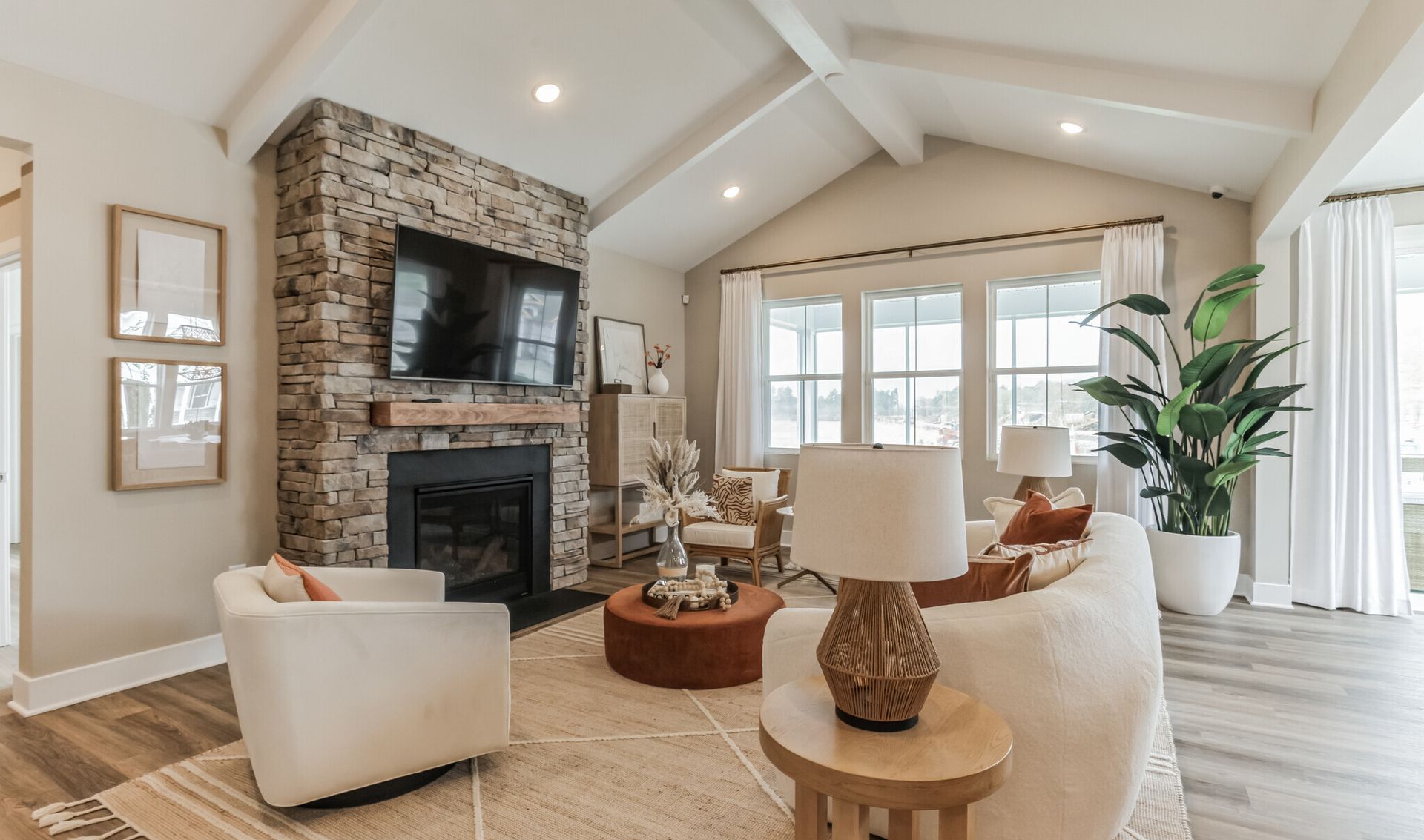 Great room with painted ceiling beams and vaulted ceilings