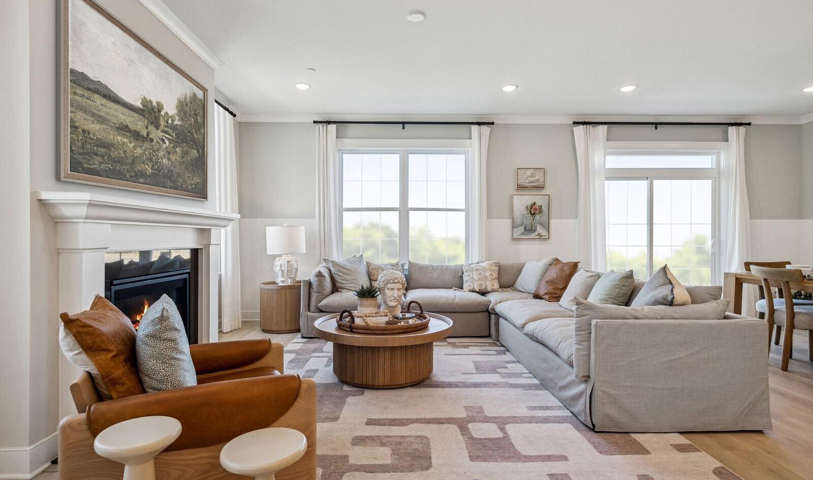 Great room with crown moulding and baseboard trim