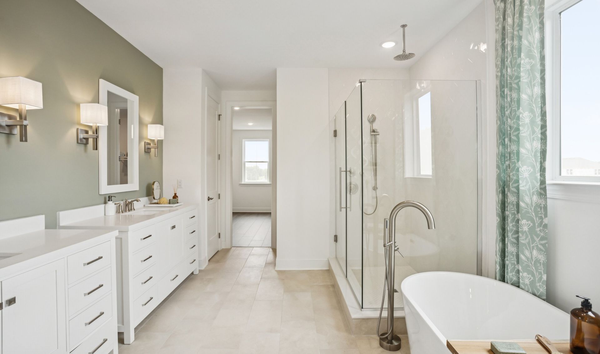 Glass shower enclosure and freestanding tub in primary bath