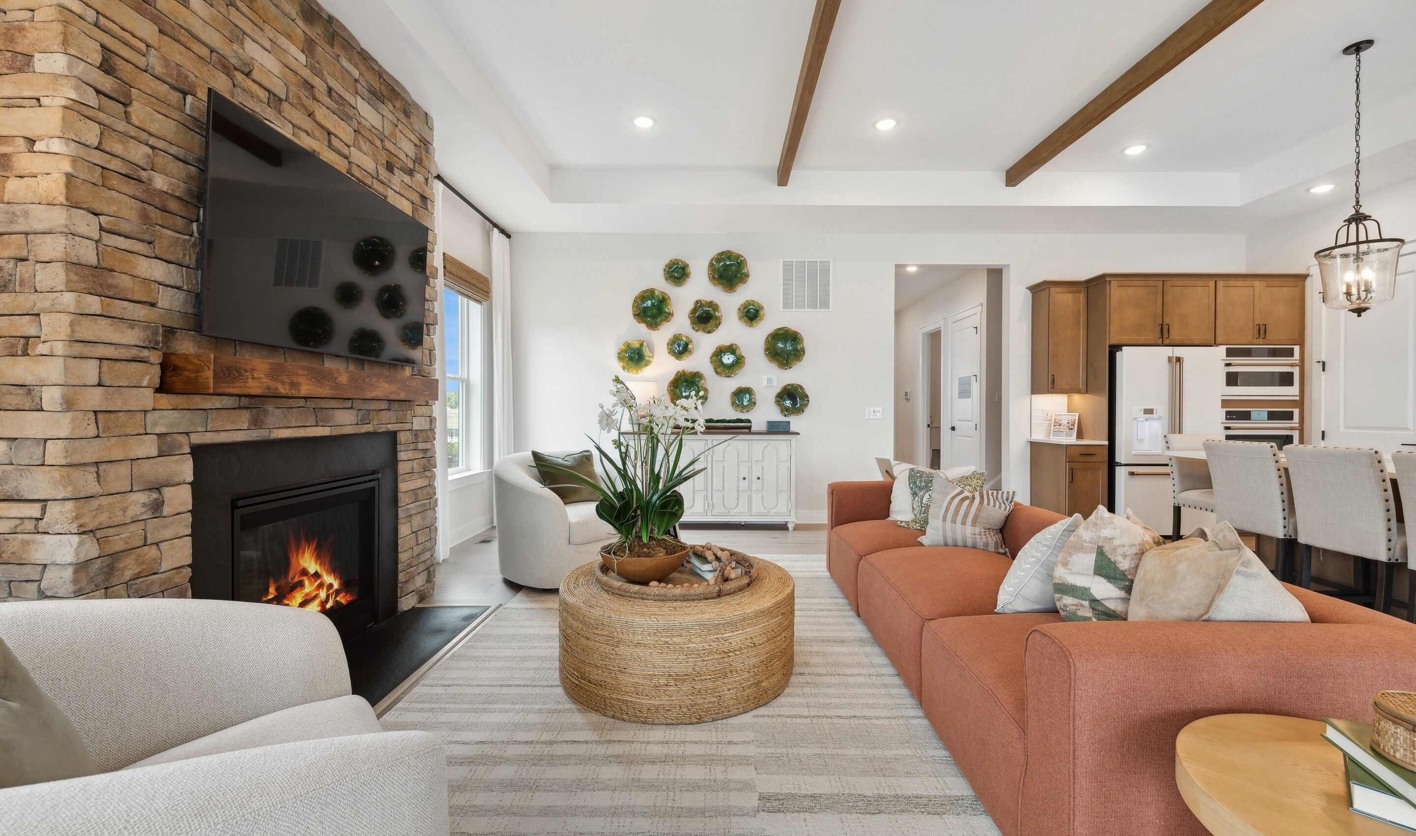 Great room with tray ceiling and stained ceiling beams