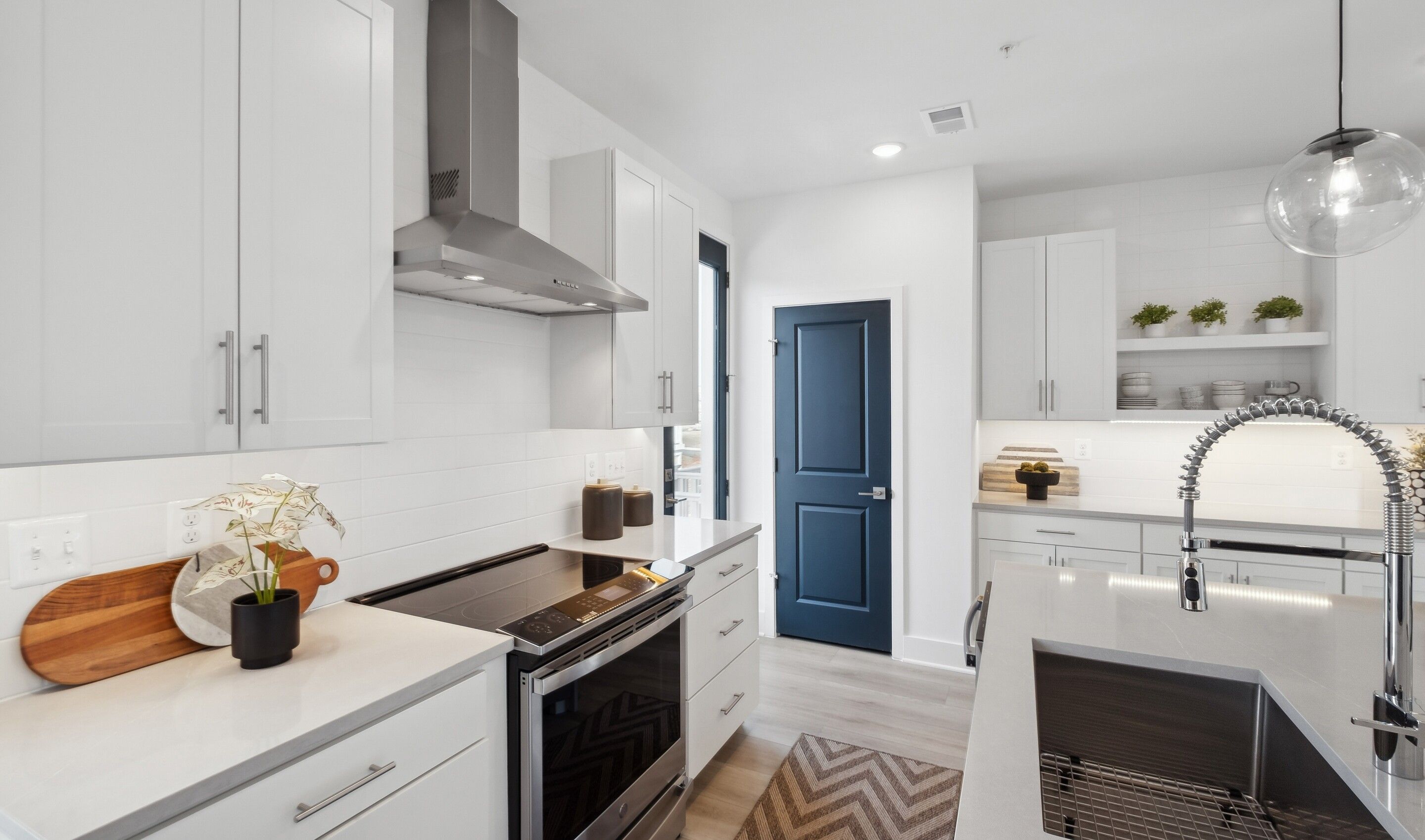 Kitchen with stainless steel hood