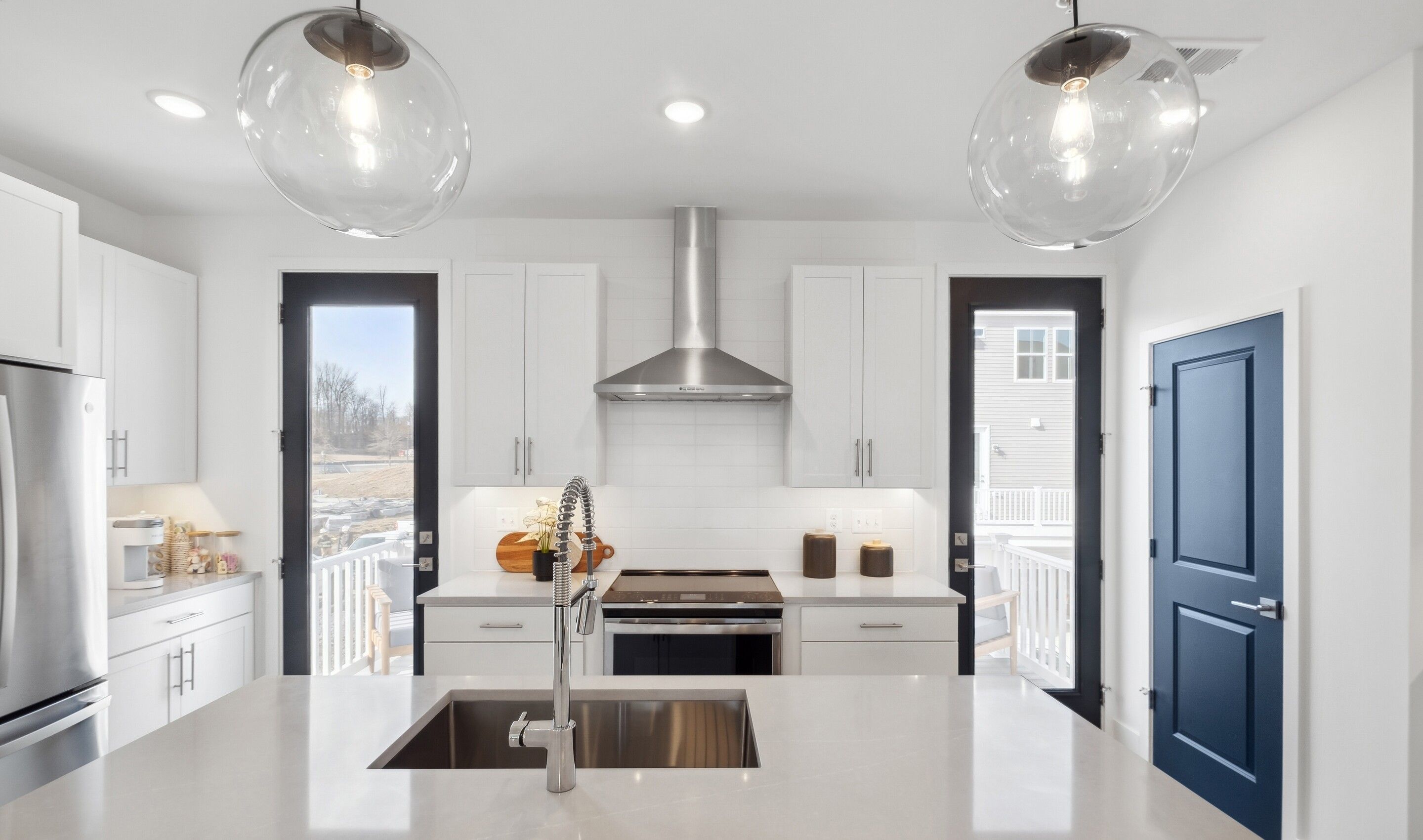 Kitchen with full-height tile backsplash