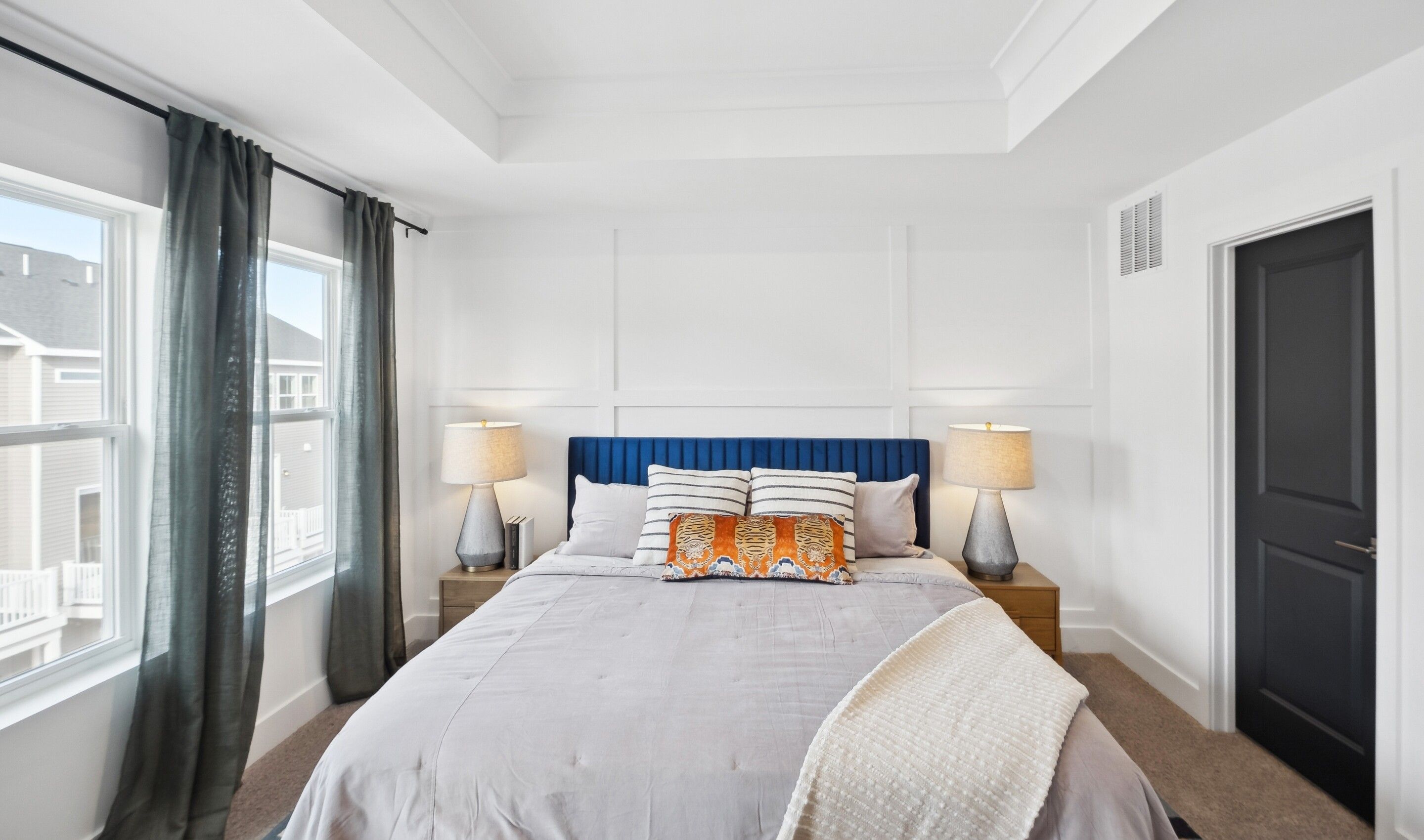 Primary suite with decorative feature wall