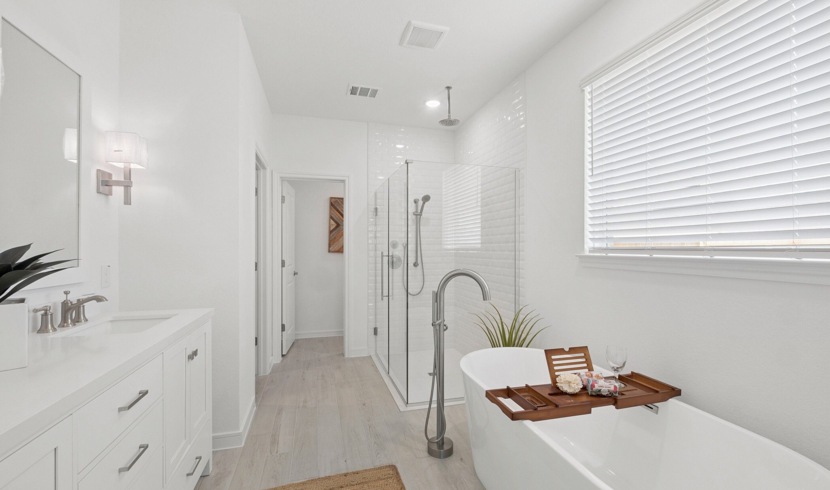 Primary bath features freestanding soaking tub