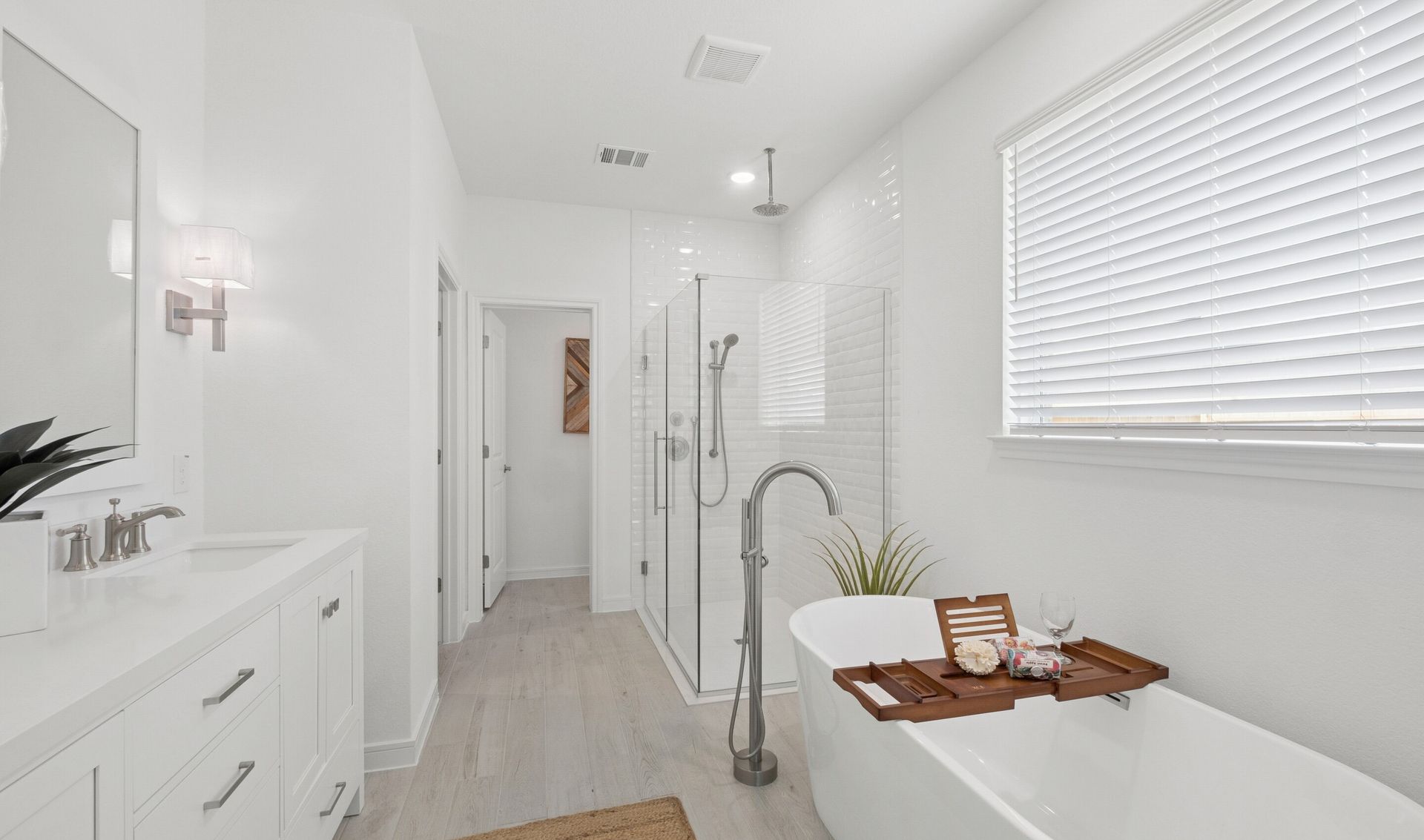 Primary bath features freestanding soaking tub