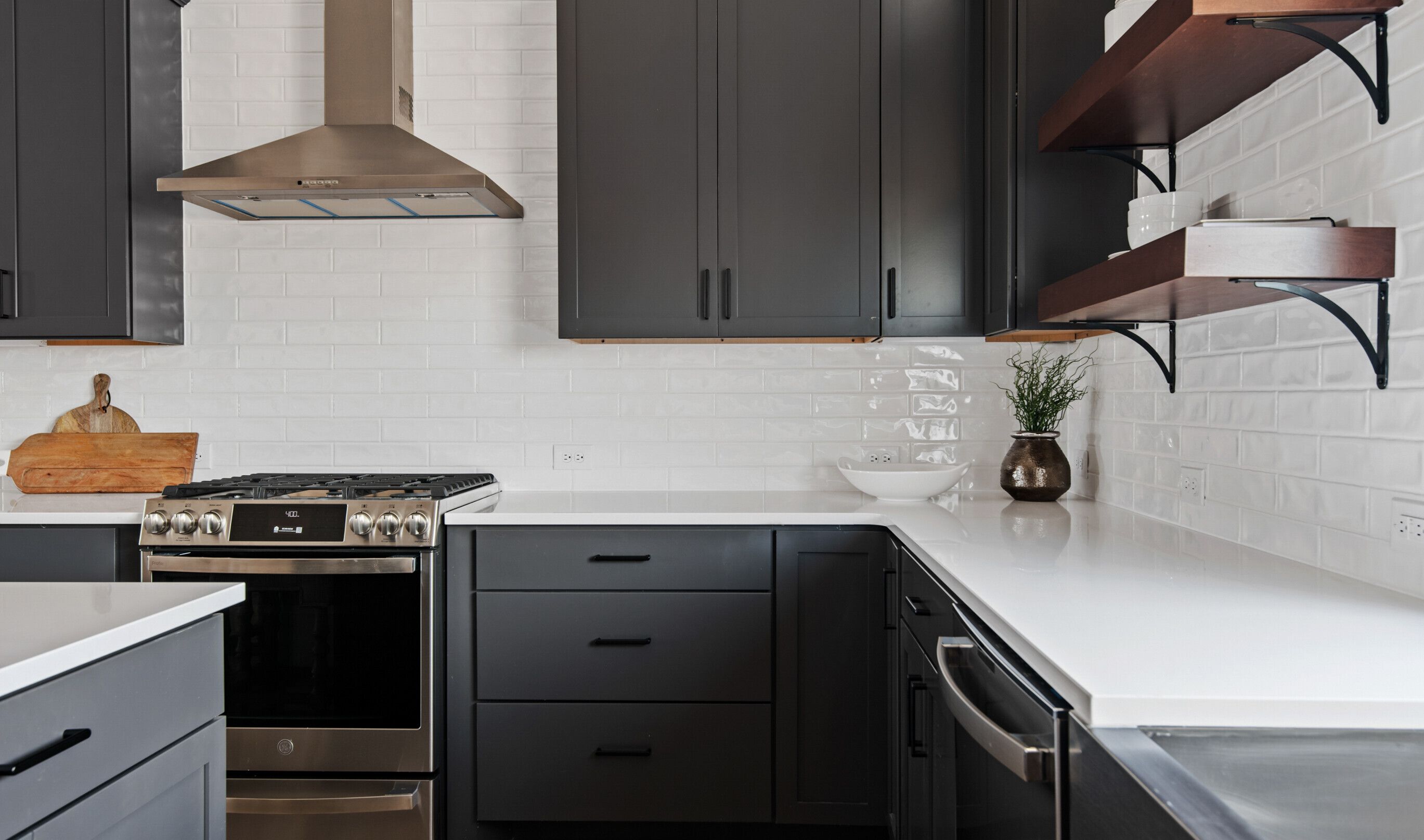 Subway tile backsplash with stainless steel hood