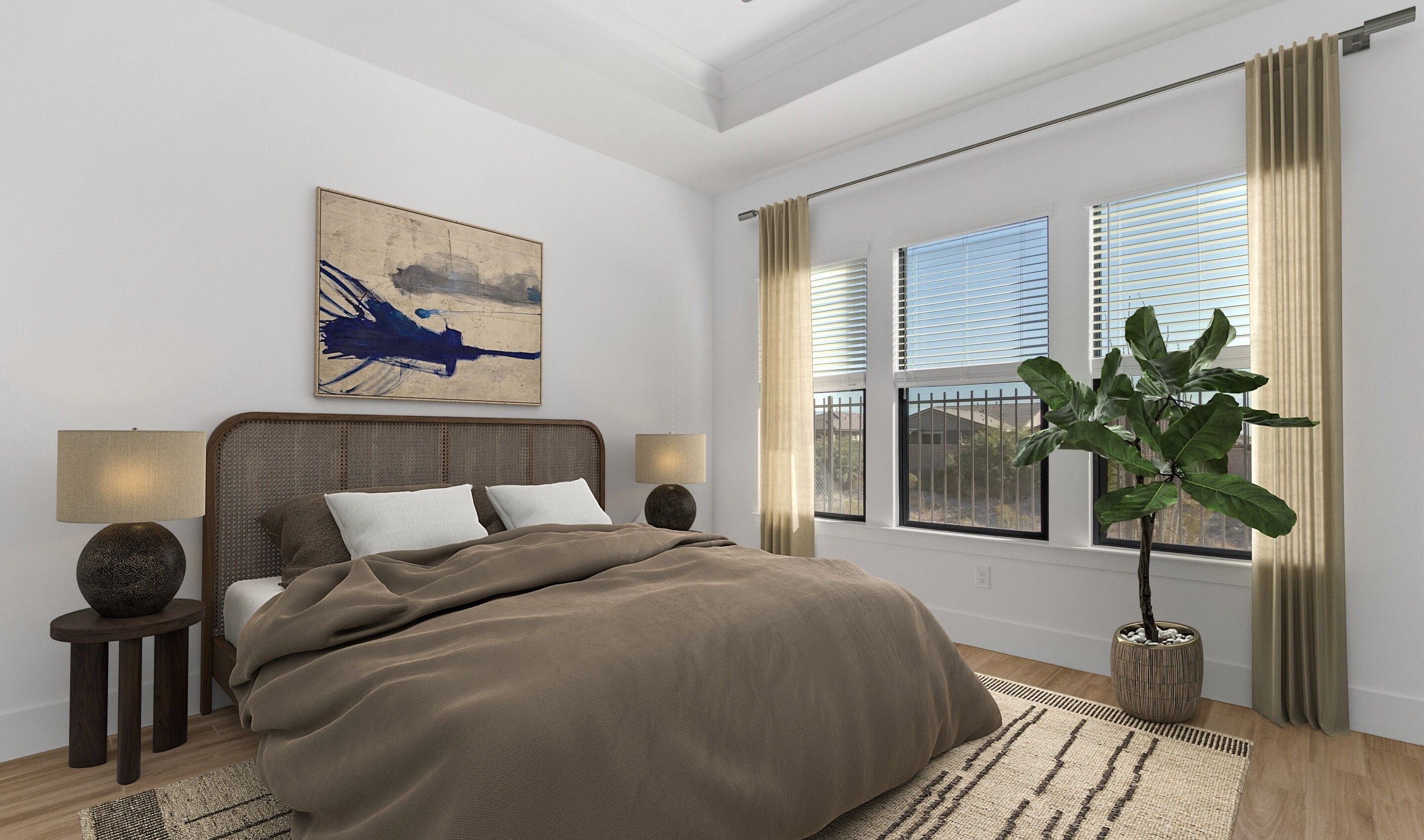 Primary suite with crown moulding and tray ceiling