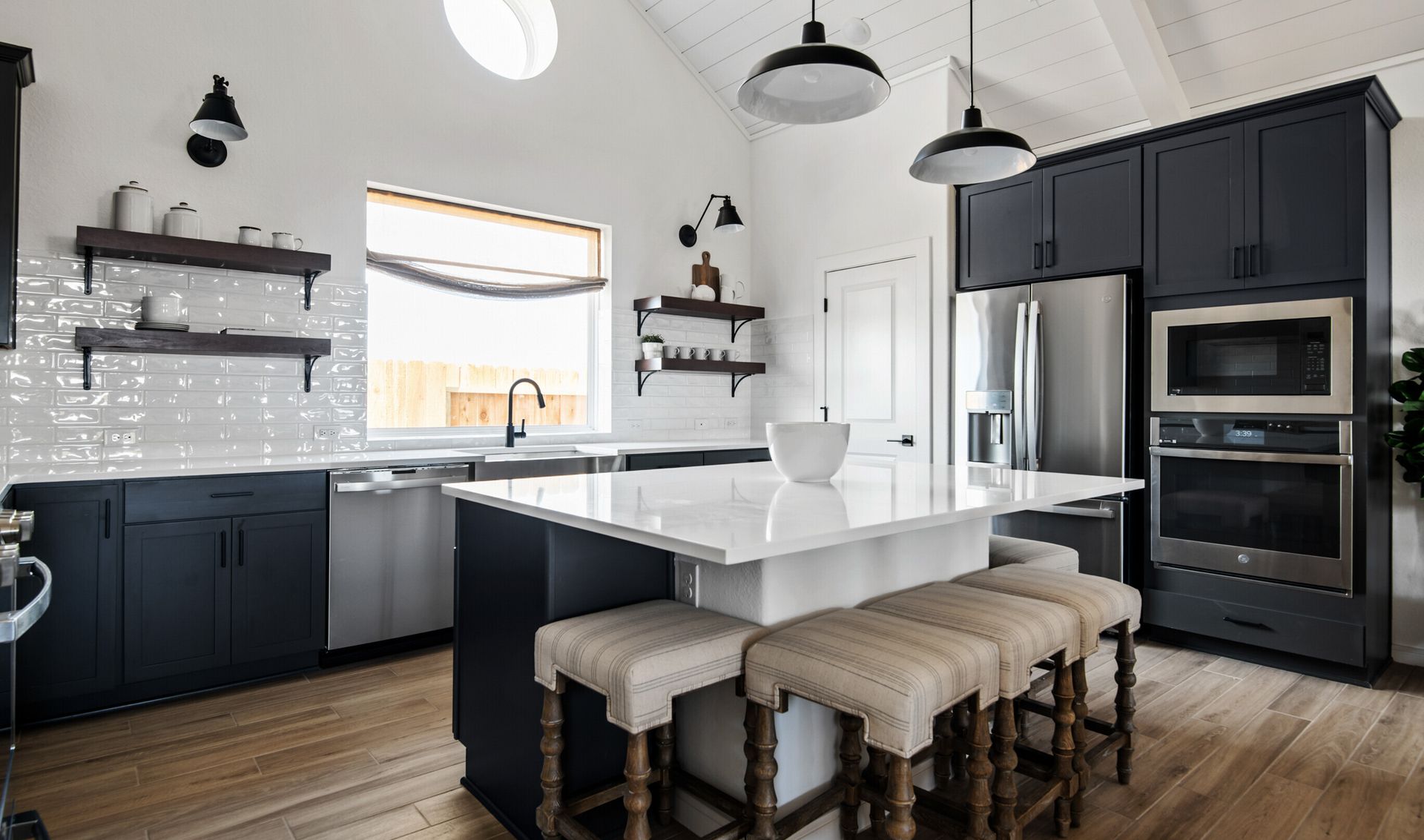 Kitchen with floating shelves and pendant lighting