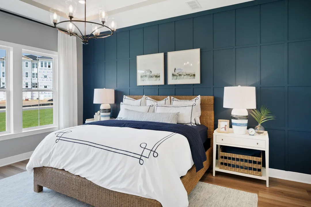 Primary suite with decorative feature wall