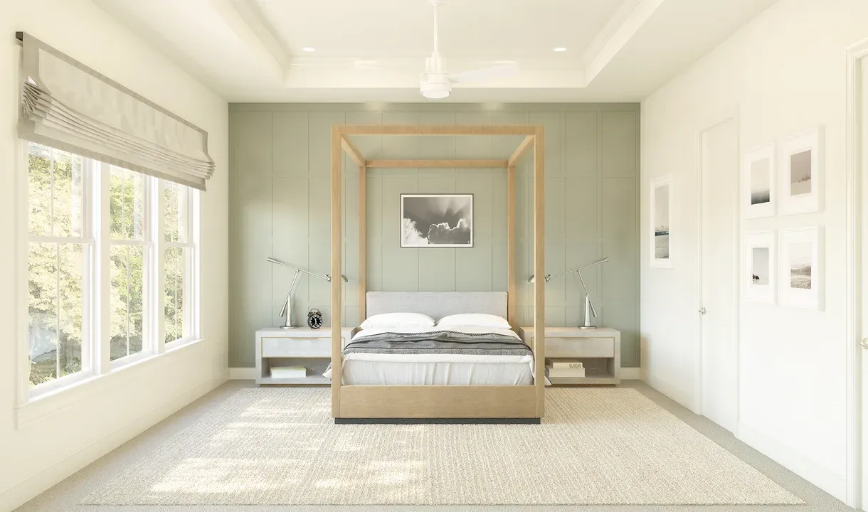 Primary suite with tray ceiling and decorative feature wall