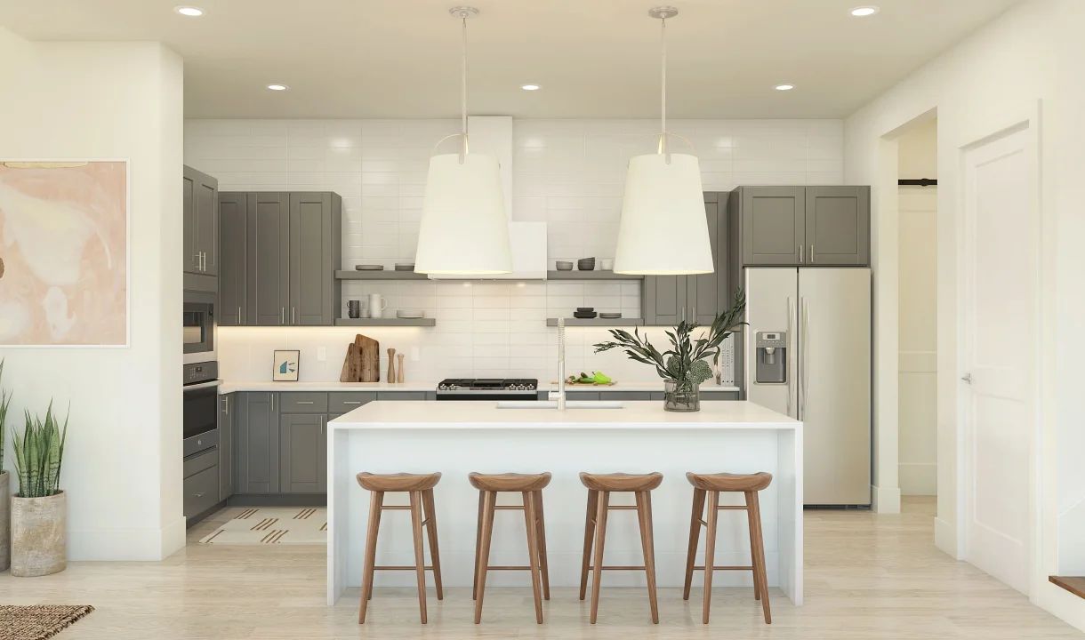 Kitchen with waterfall island and pendant lighting