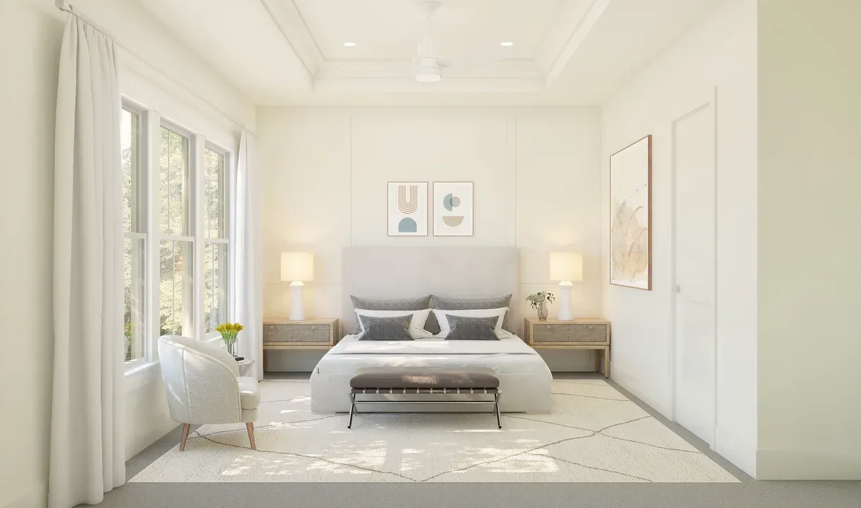 Primary suite with tray ceiling and decorative feature wall