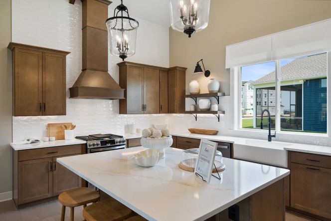 Kitchen with island, pendant lighting and tile backsplash