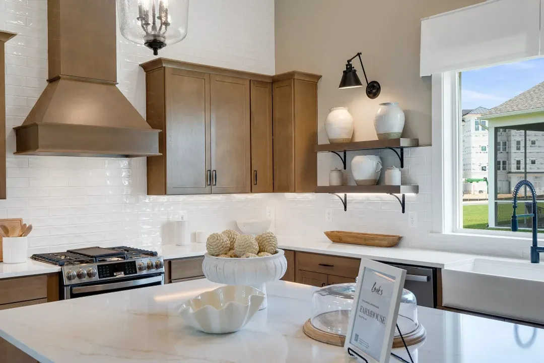 Kitchen with island, pendant lighting and tile backsplash