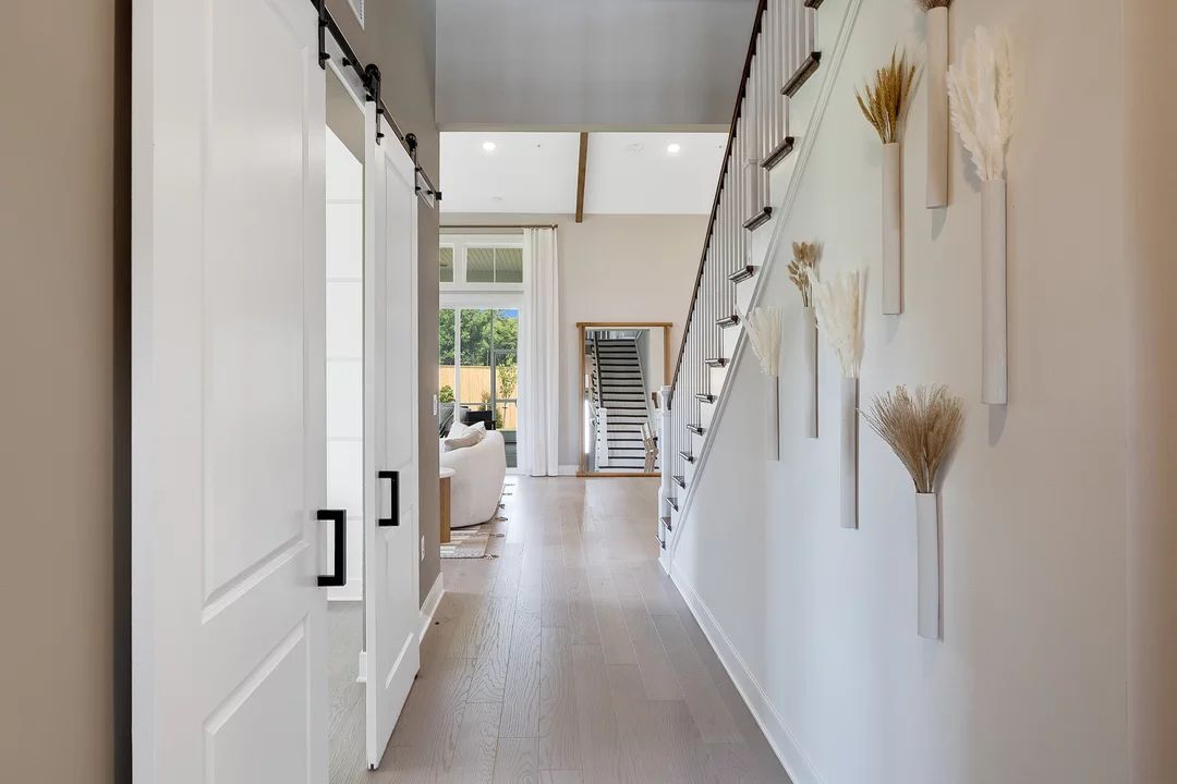 Foyer with home office featuring double barn doors