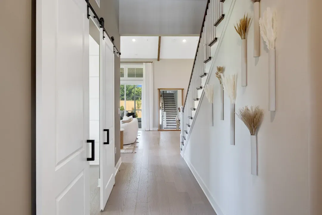 Foyer with home office featuring double barn doors