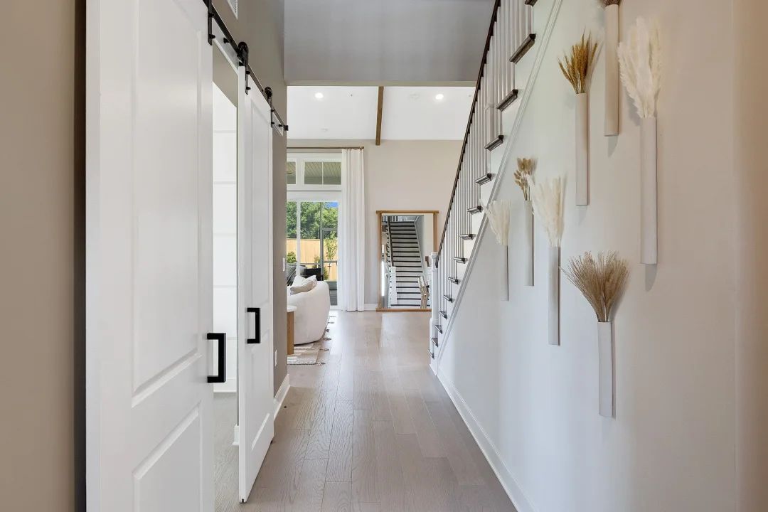 Foyer with home office featuring double barn doors