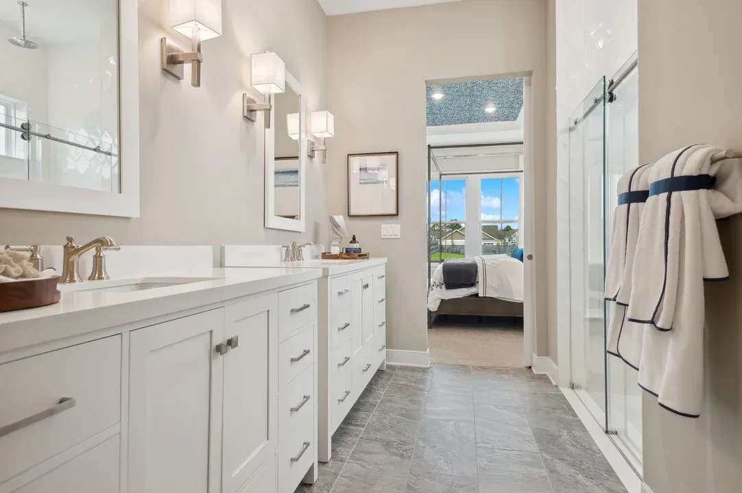 Primary bath with freestanding vanities