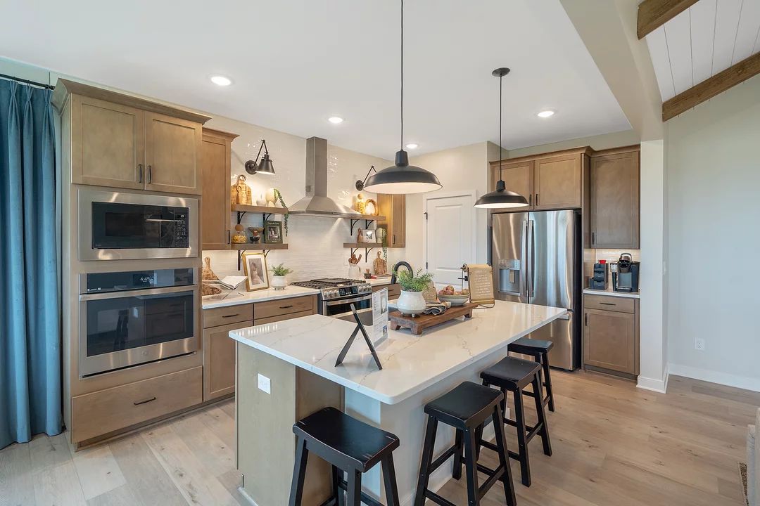 Kitchen with pendant lights and vast island