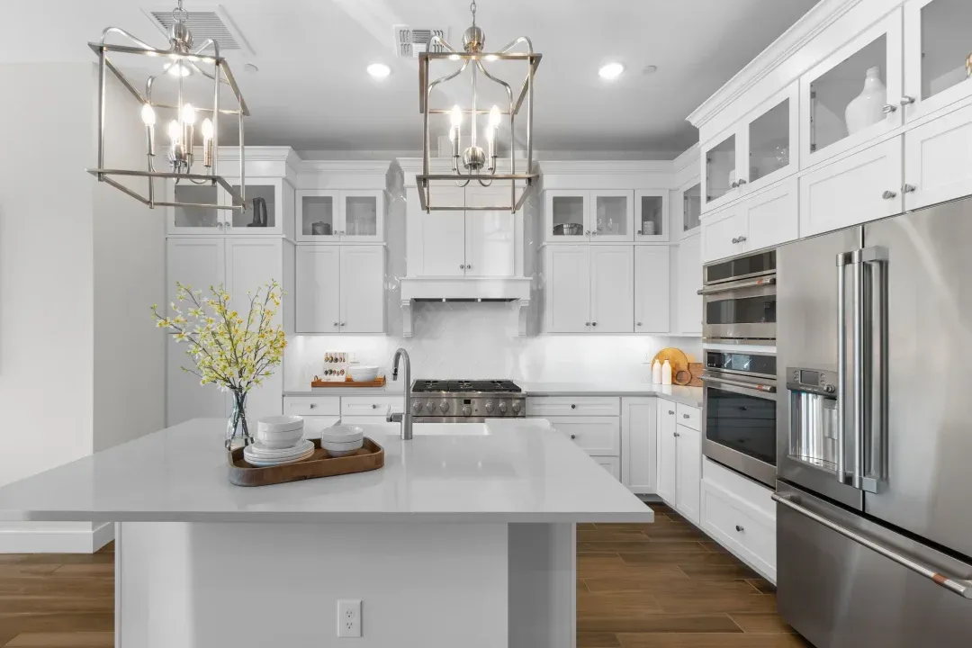 Kitchen with pendant lighting and glass upper cabinets