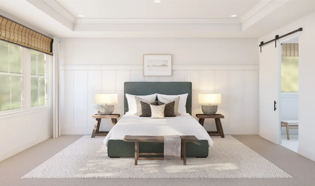 Primary suite with tray ceiling and decorative feature wall