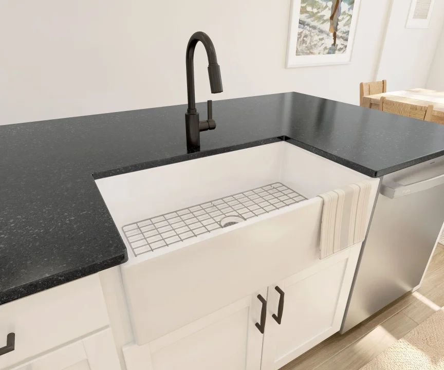 Kitchen with white apron-front sink and matte black fixtures