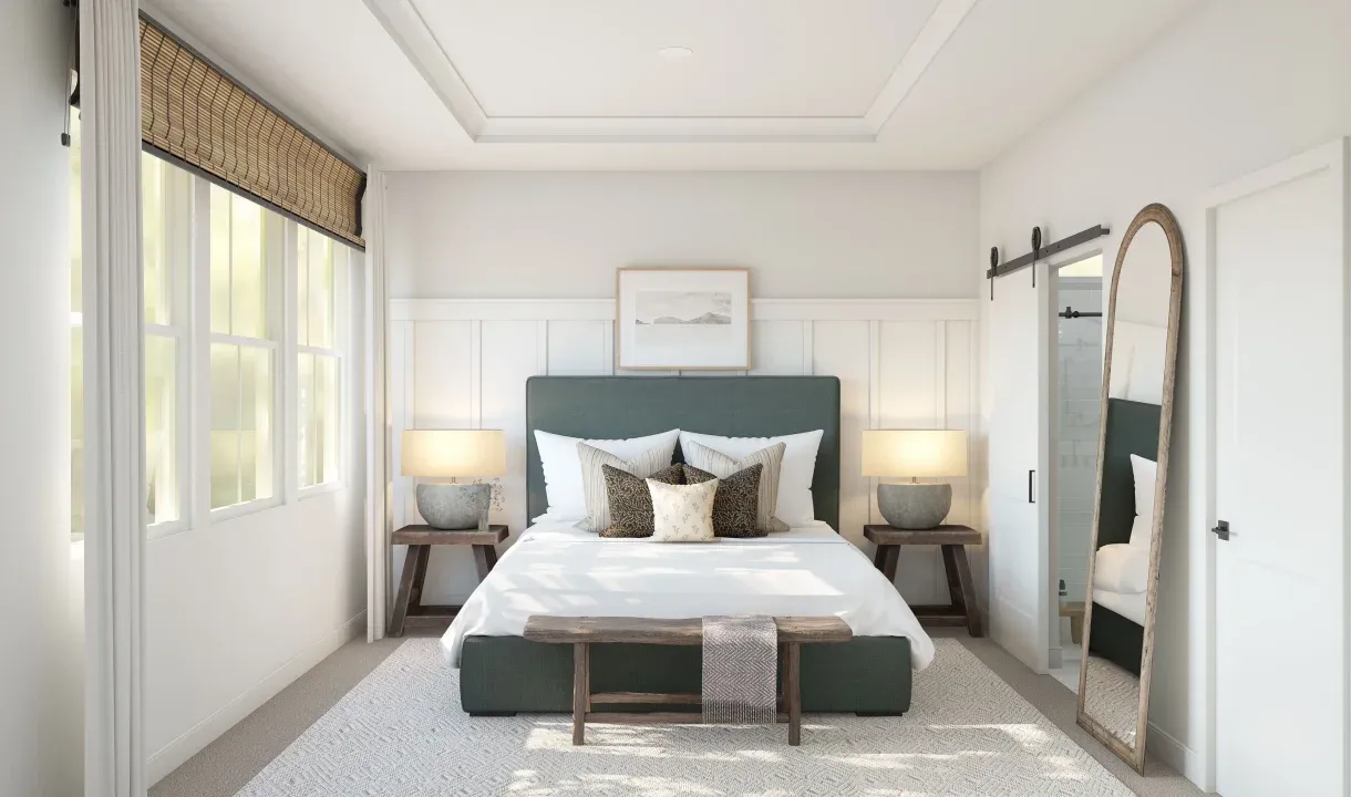 Primary suite with tray ceiling and decorative feature wall