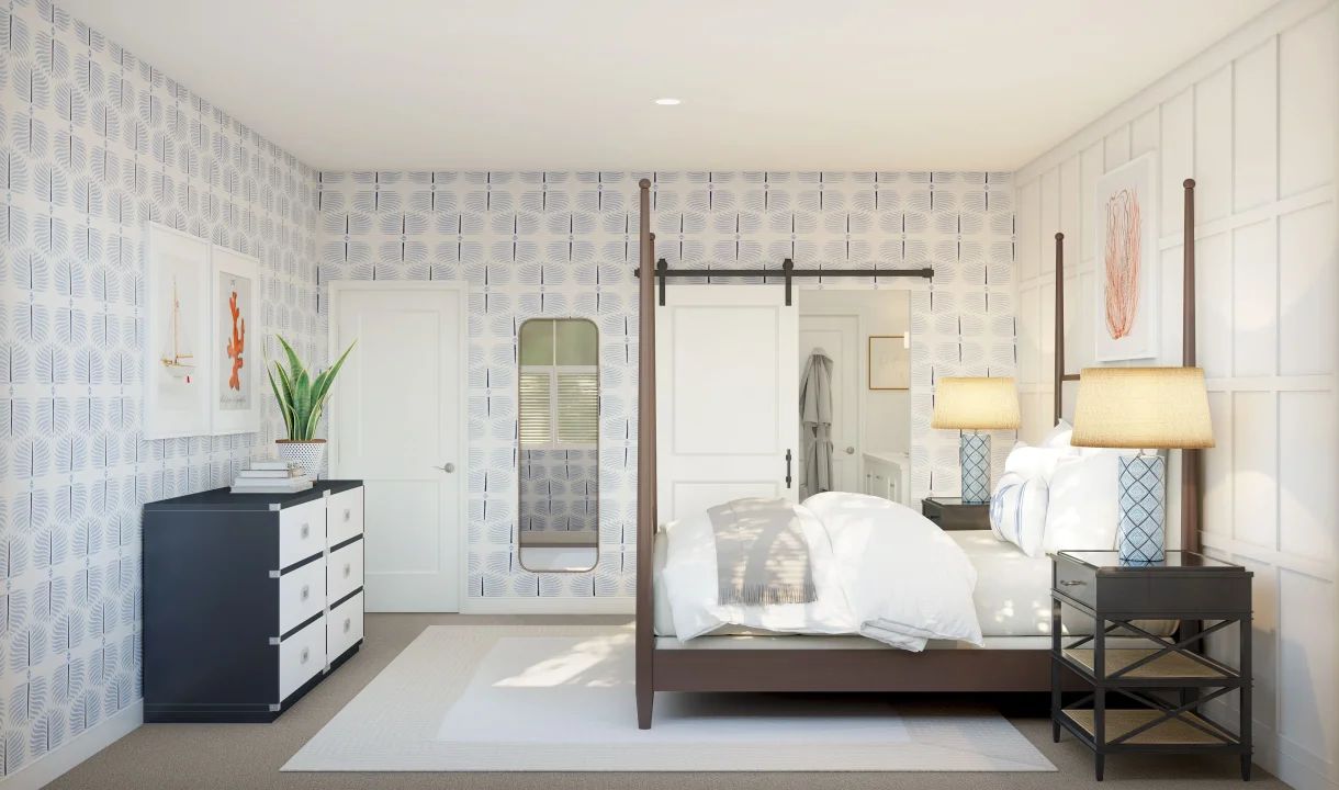 Primary suite with barn door and decorative feature wall
