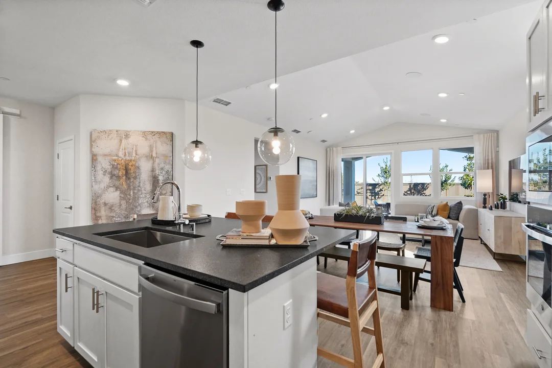 Kitchen with vaulted ceiling and pendant lighting