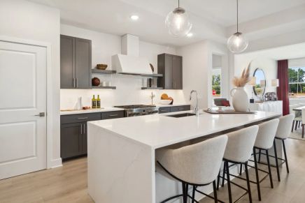 Kitchen with waterfall-edge central island