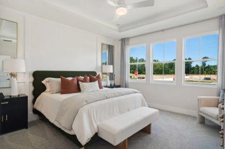 Primary suite with elegant ceiling treatment