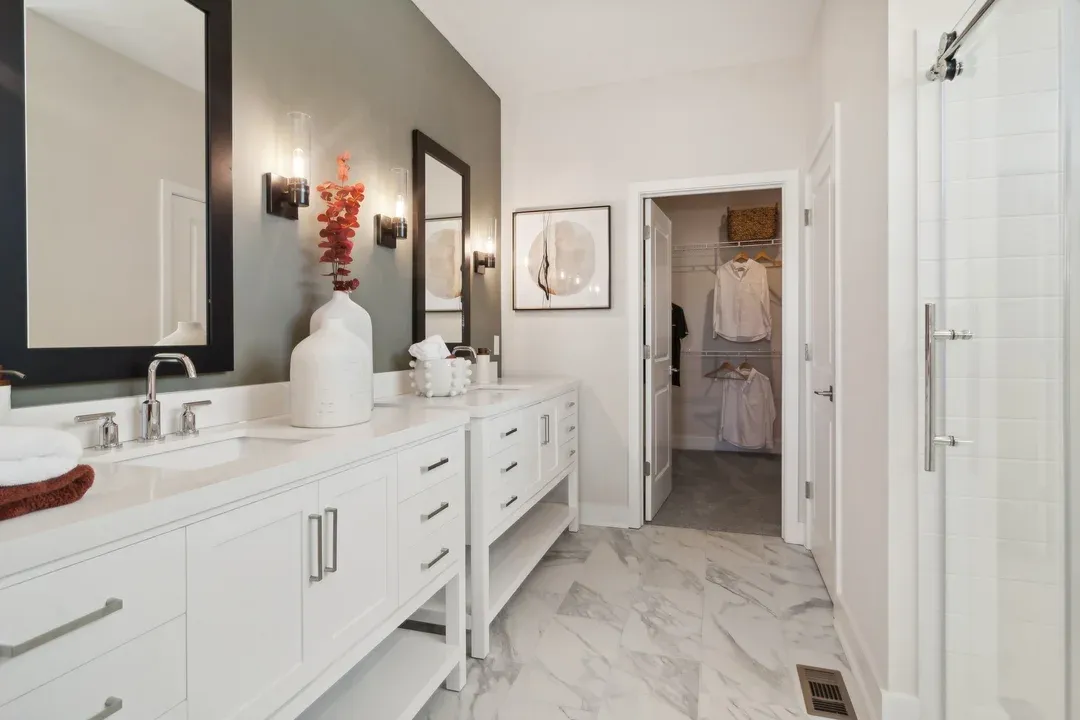 Primary bath with dual freestanding vanities