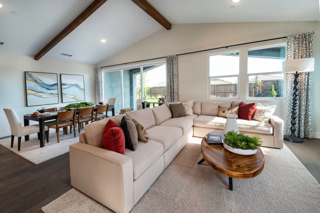 Great room with vaulted ceiling and stained ceiling beams