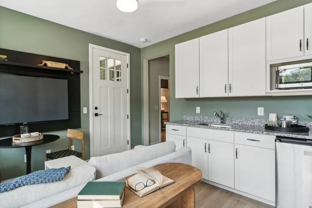 Extra Suite Plus living room with kitchenette and private entry