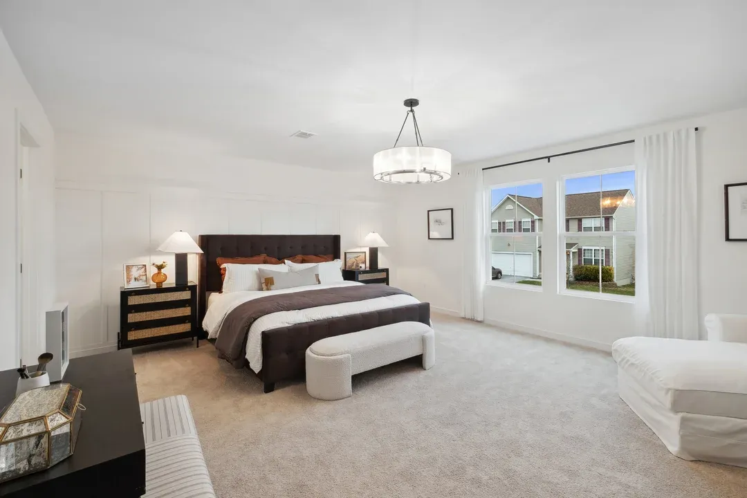 Primary suite with decorative feature wall