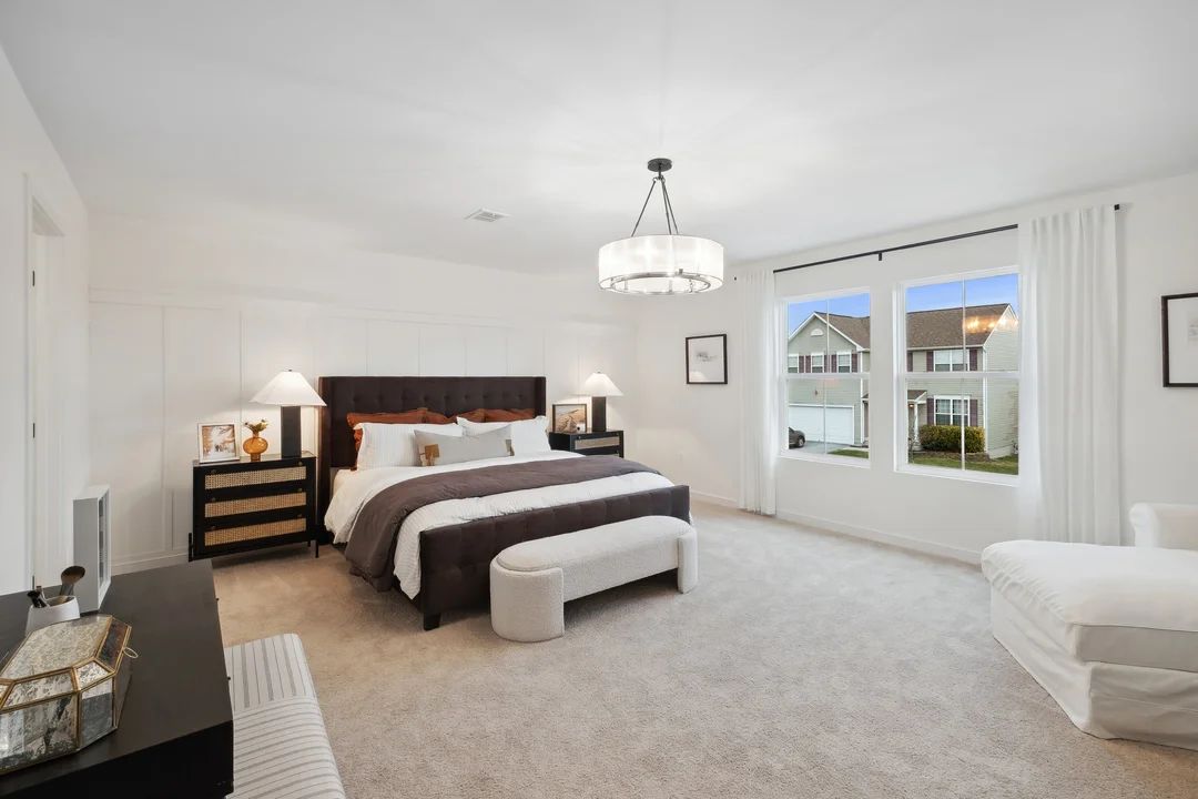 Primary suite with decorative feature wall