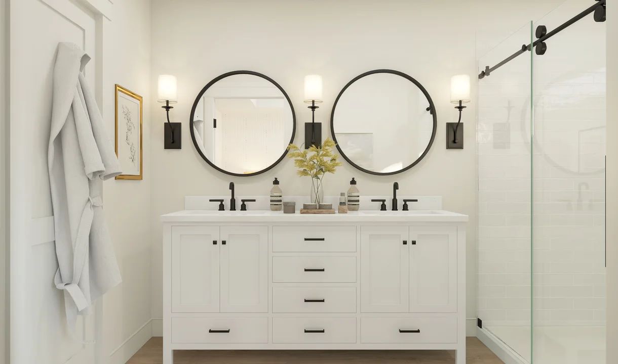 Primary bath features freestanding vanity with dual sinks