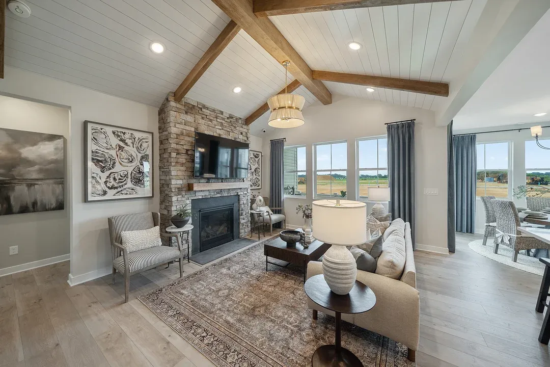 Great room with vaulted ceiling and stained ceiling beams