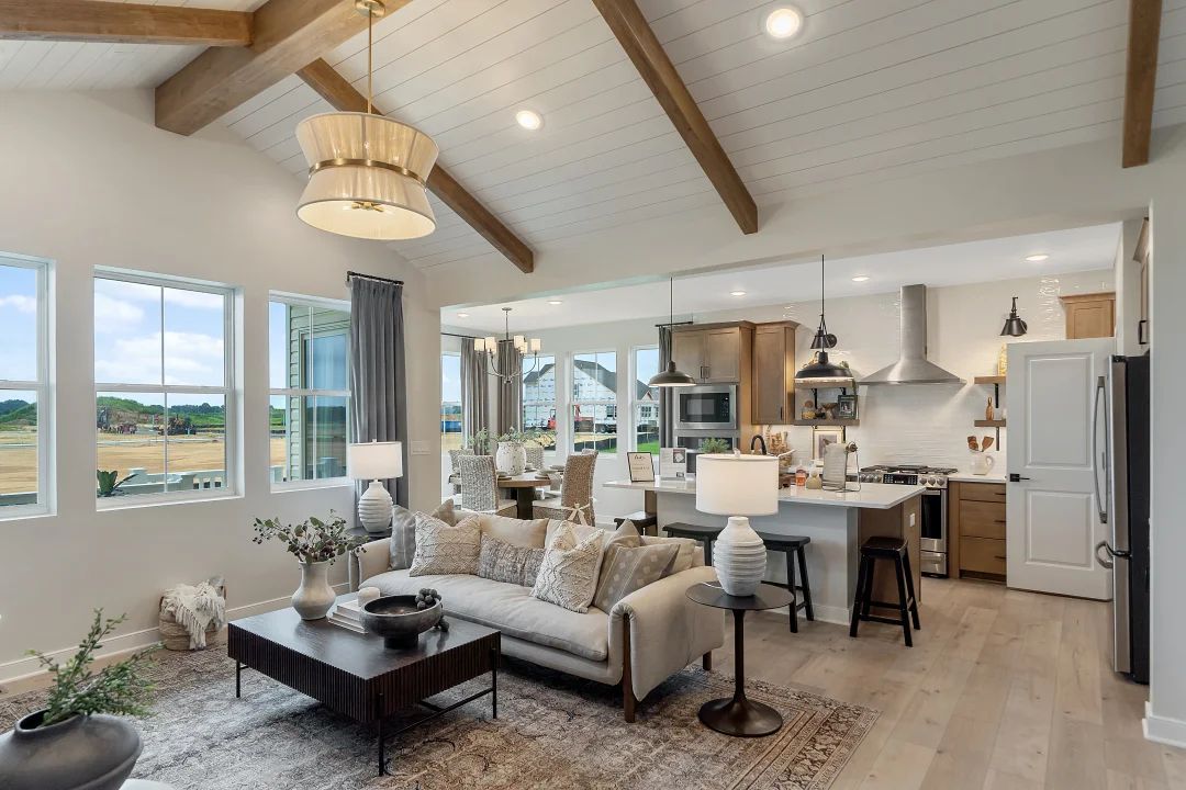 Great room with stained ceiling beams and vaulted ceilings