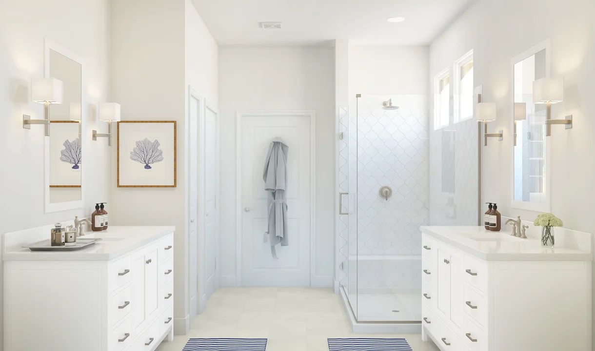 Primary bath with dual sinks and glass shower enclosure