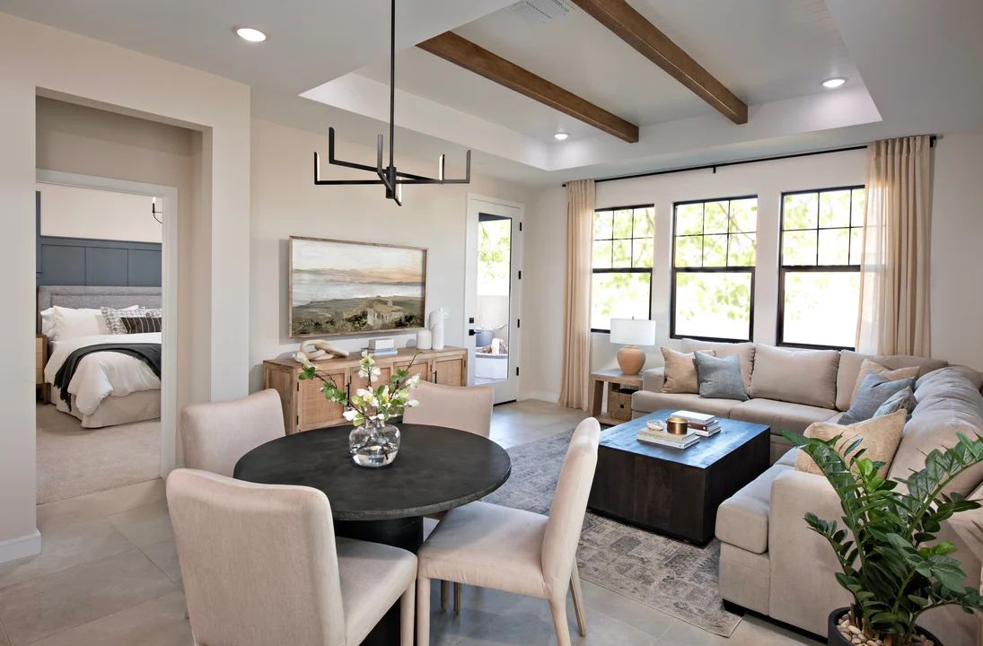 Dining area with stained ceiling beams