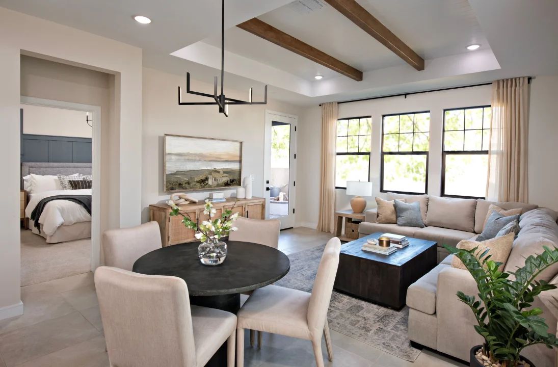 Dining area with stained ceiling beams