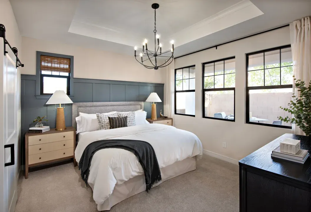 Primary suite with tray ceiling and chandelier