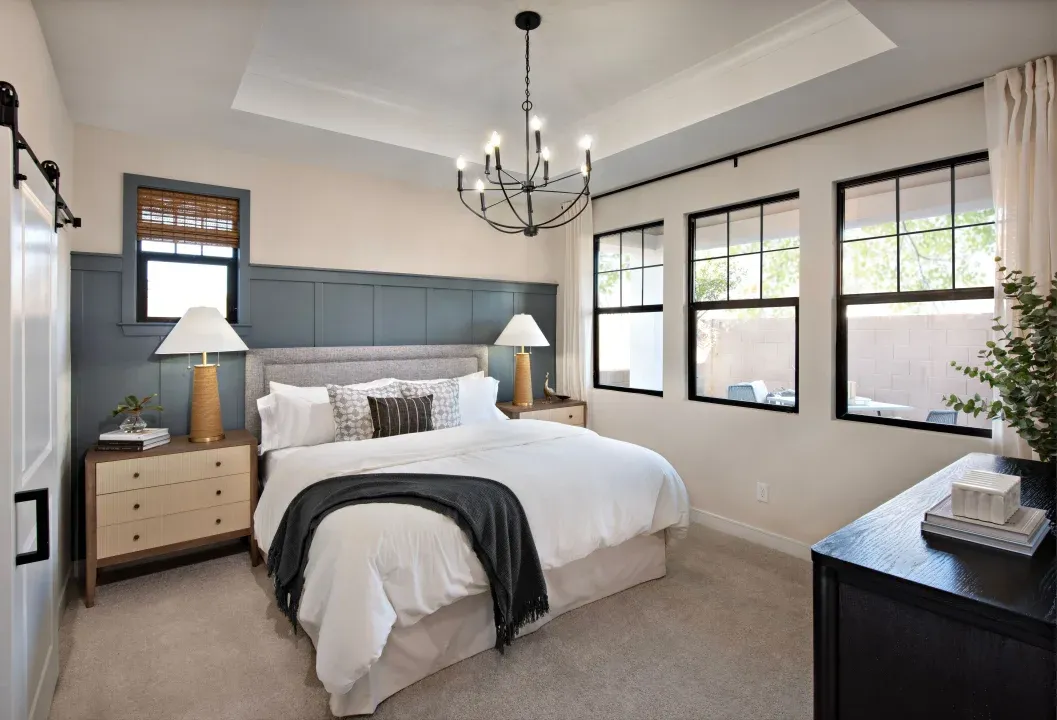 Primary suite with tray ceiling and chandelier