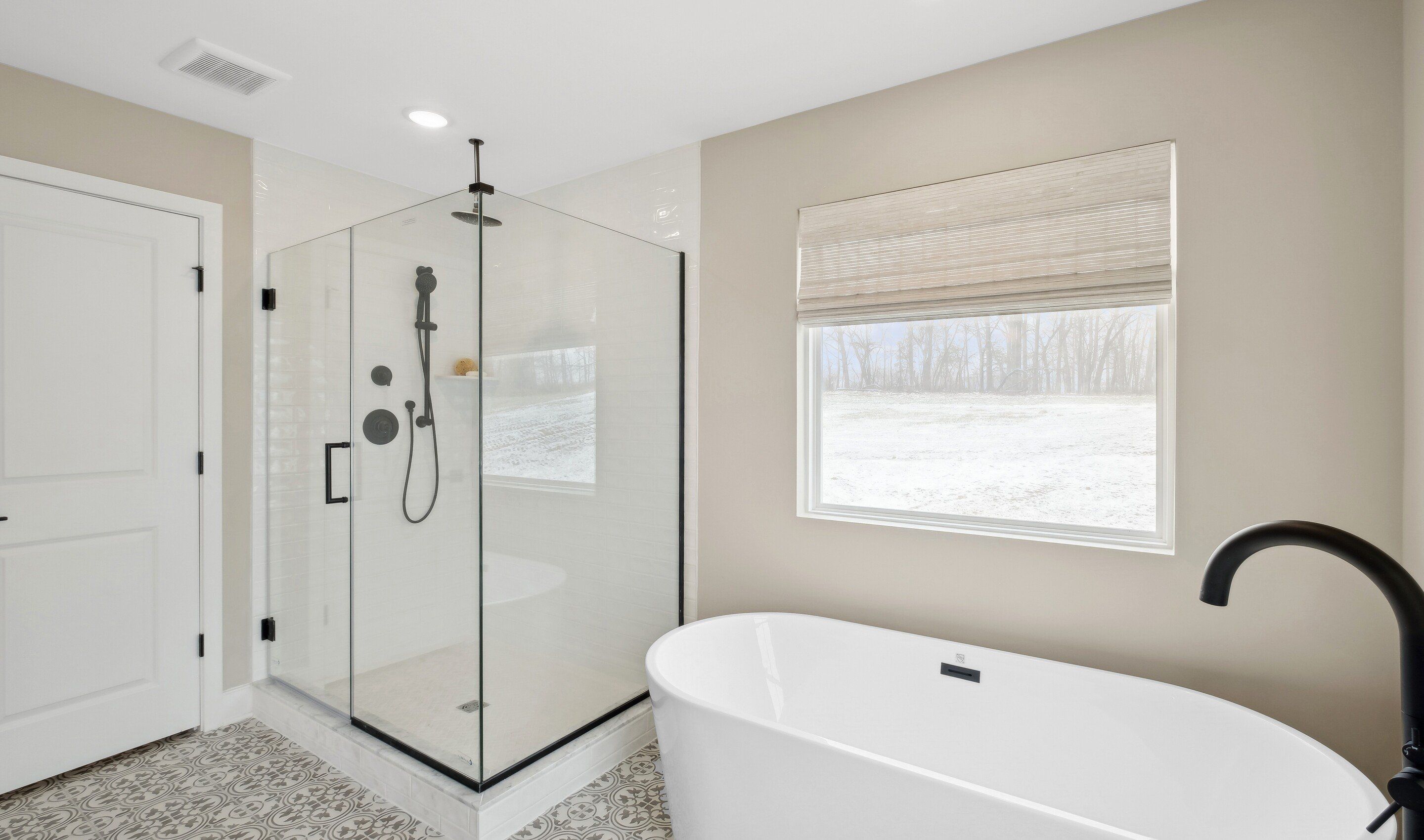 Primary bath with glass-shower enclosure